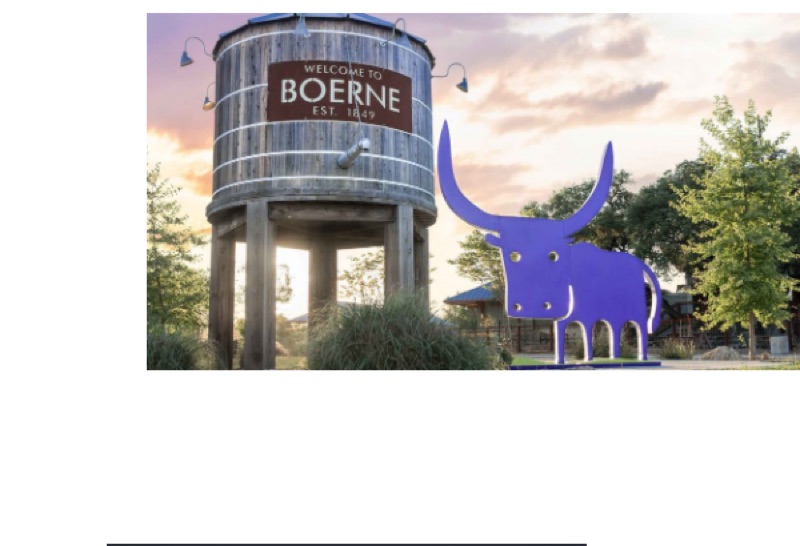 Welcome to Boerne - water tower with the giant purple longhorn sculpture